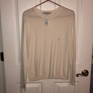 Long sleeve white sweater.